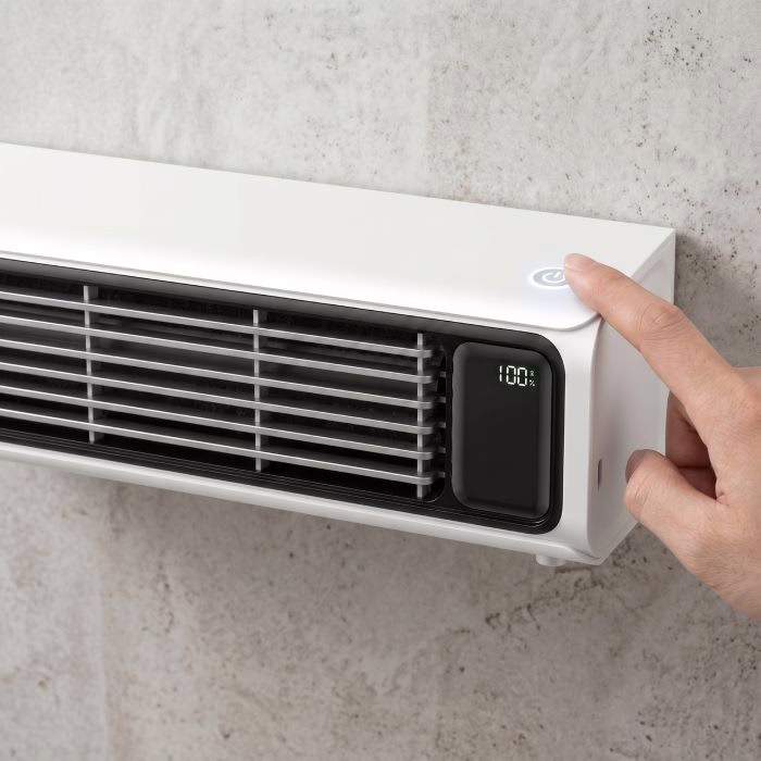A finger pressing the touch control panel on the wall mounted FrostyLax cooler